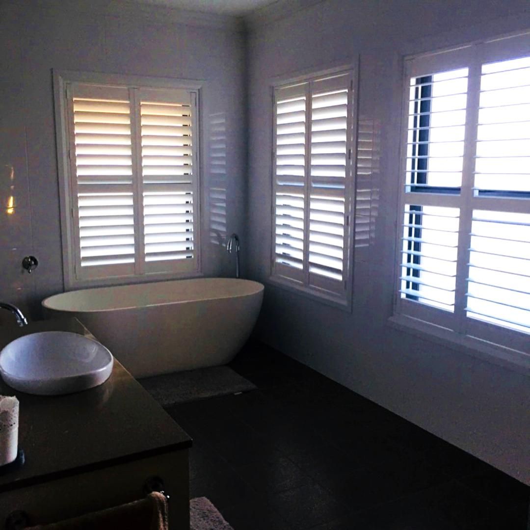 Bathroom With White Shutters And Standalone Tub — JSF Interiors Goulburn in Berry, NSW