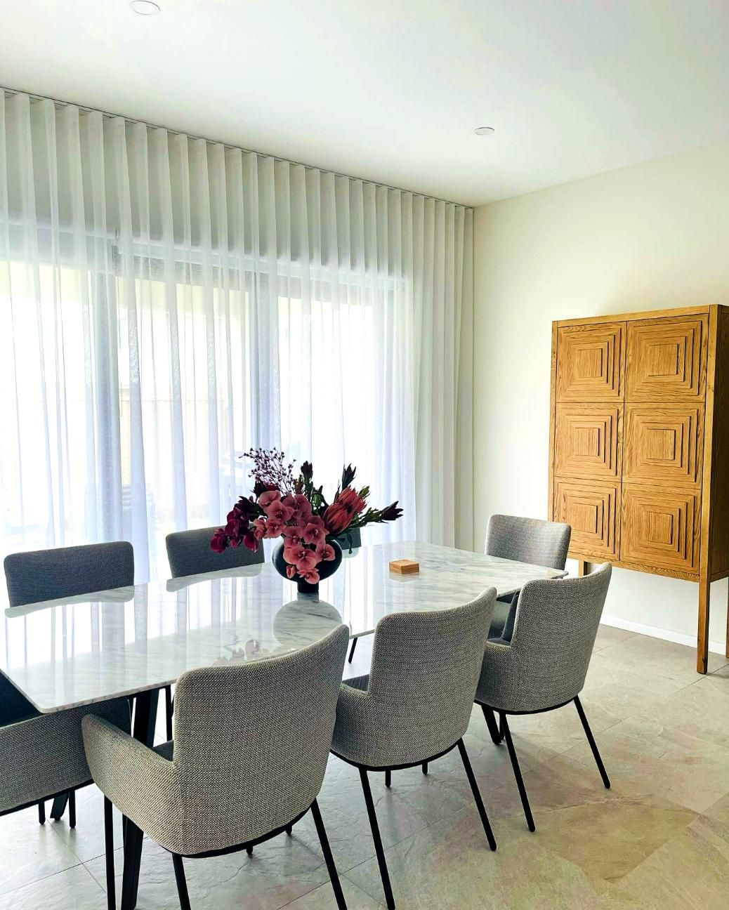 Dining Room With Marble Table And Gray Chairs — JSF Interiors Goulburn in Albion Park, NSW