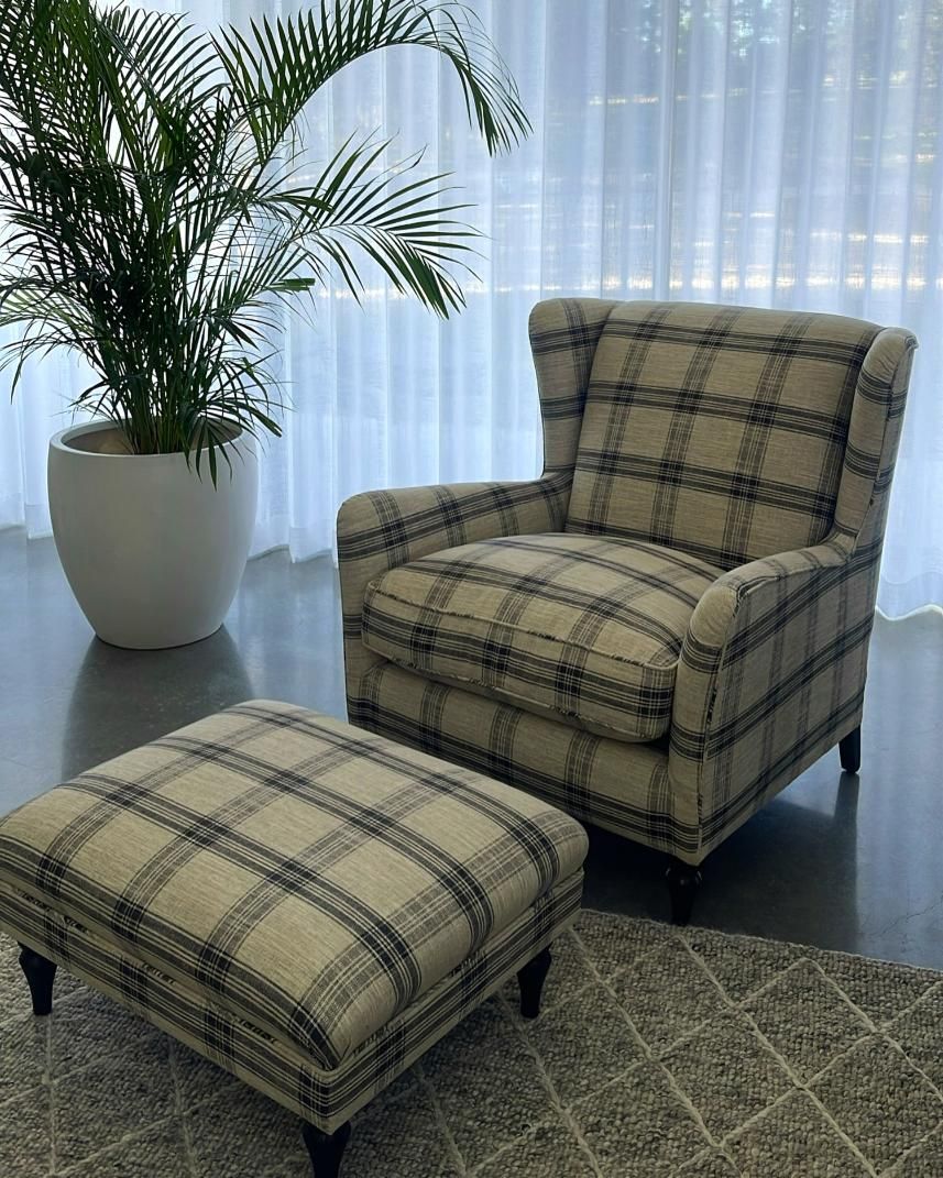 Plaid Armchair And Ottoman Next To Potted Plant — JSF Interiors Goulburn in Goulburn, NSW