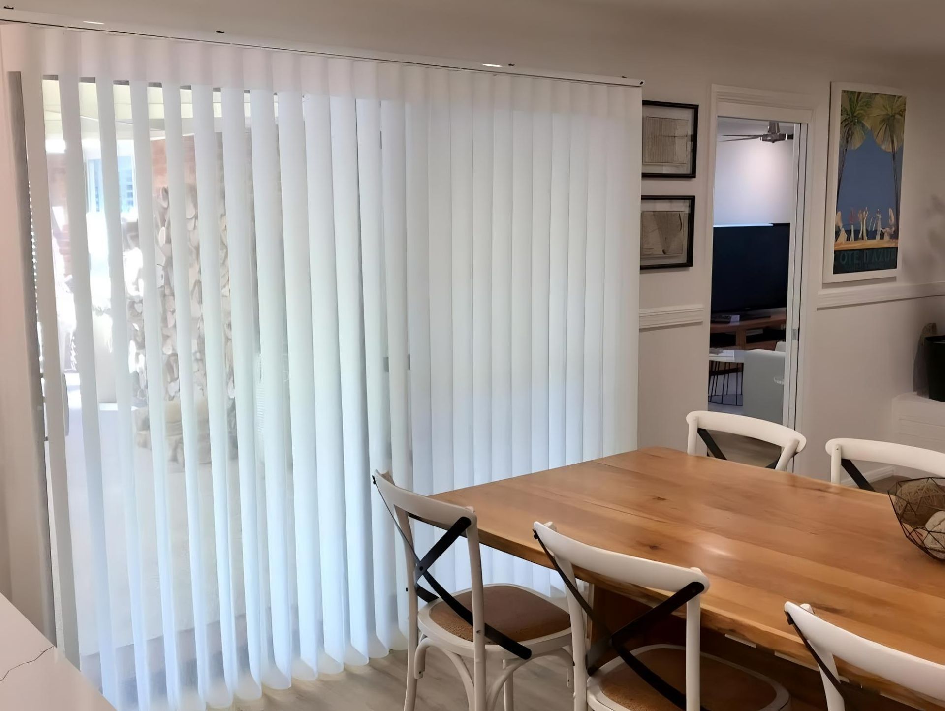 White Vertical Blinds On Sliding Glass Door — JSF Interiors Goulburn in Goulburn, NSW