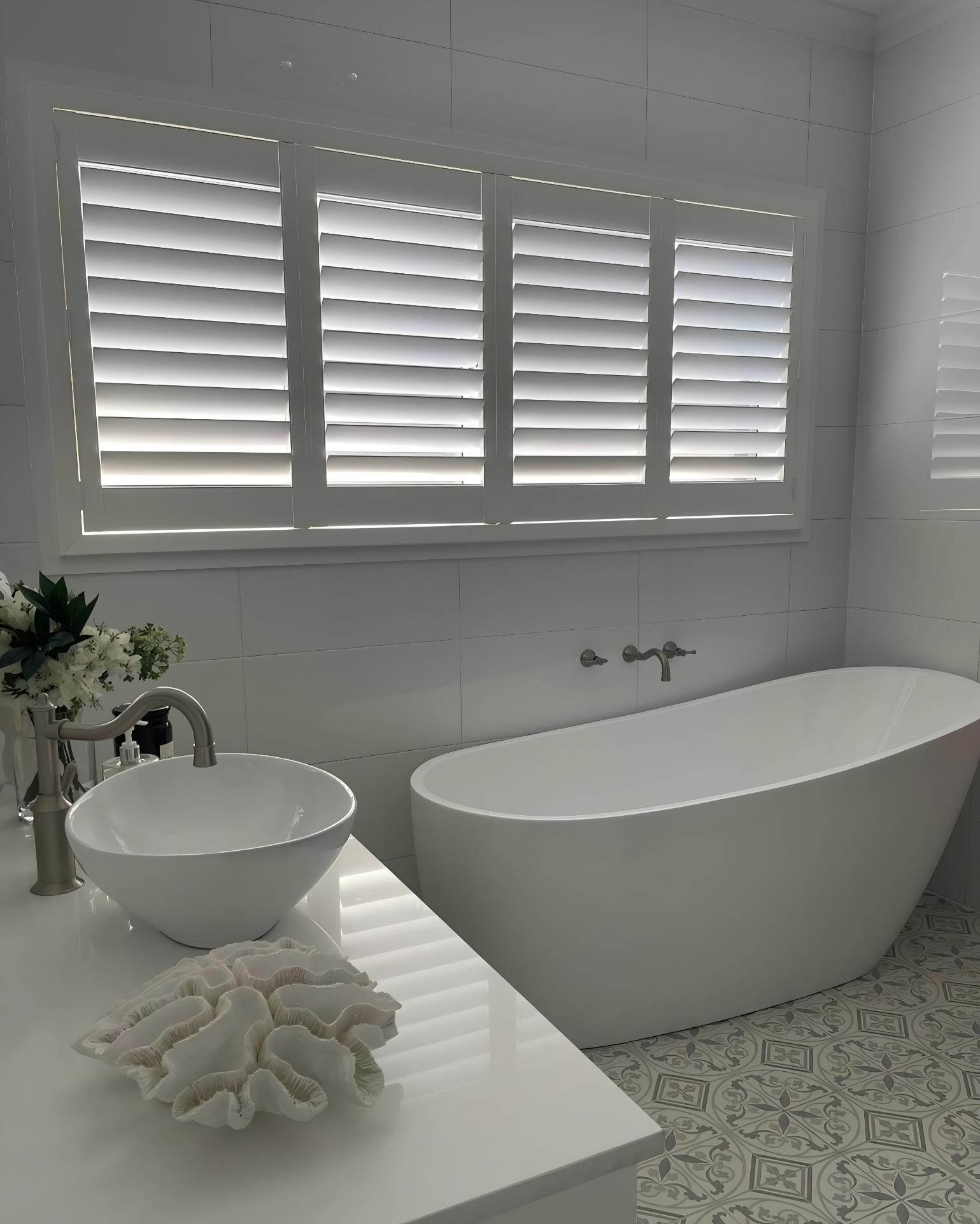 White Bathroom With Freestanding Tub And Shutters — JSF Interiors Goulburn in Goulburn, NSW