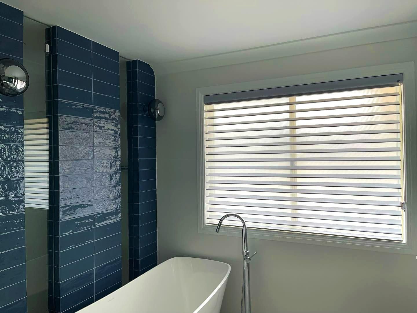 Bathroom With Blue Tiled Wall And Closed Blinds — JSF Interiors Goulburn in Mittagong, NSW