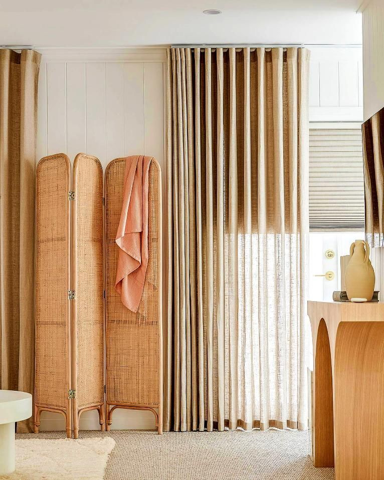 Rattan Room Divider With Coral Blanket And Beige Curtains — JSF Interiors Goulburn in Bowral, NSW