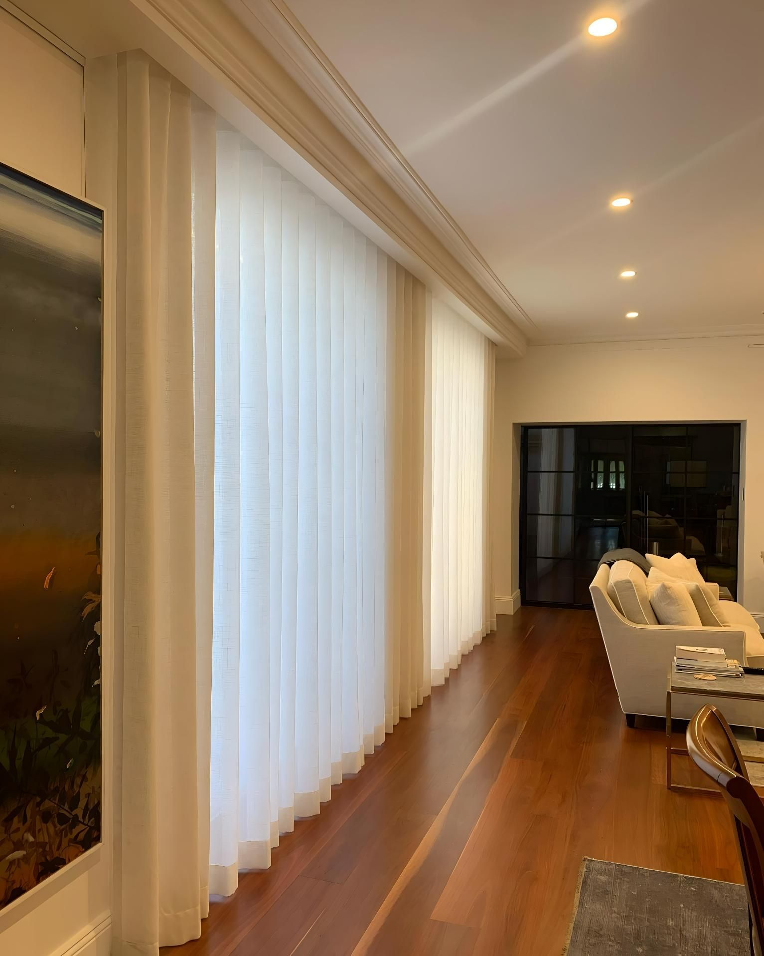 Living Room With Large Window And Sheer White Curtains — JSF Interiors Goulburn in Goulburn, NSW
