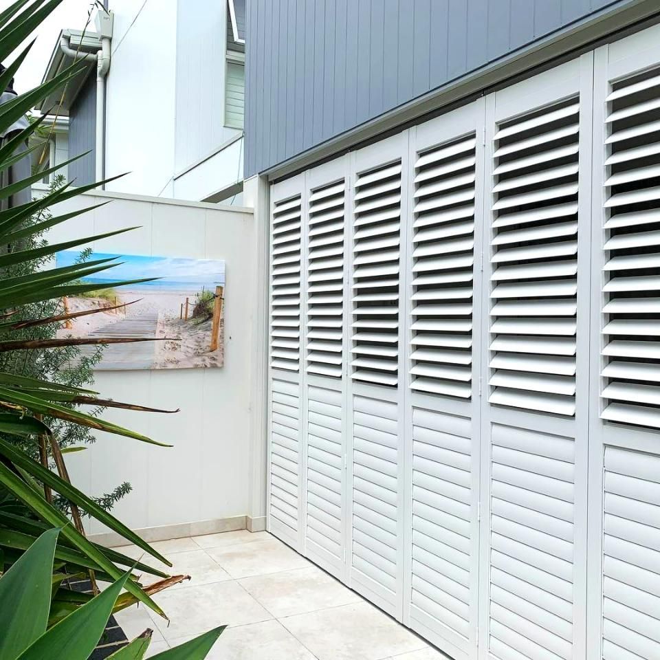 White Louvered Garage Doors On Modern Home — JSF Interiors Goulburn in Southern Highlands, NSW