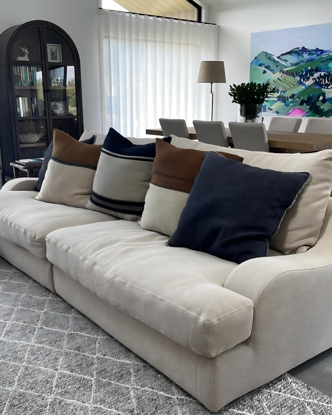 Cream Sofa With Patterned Pillows In Bright Living Room — JSF Interiors Goulburn in Goulburn, NSW