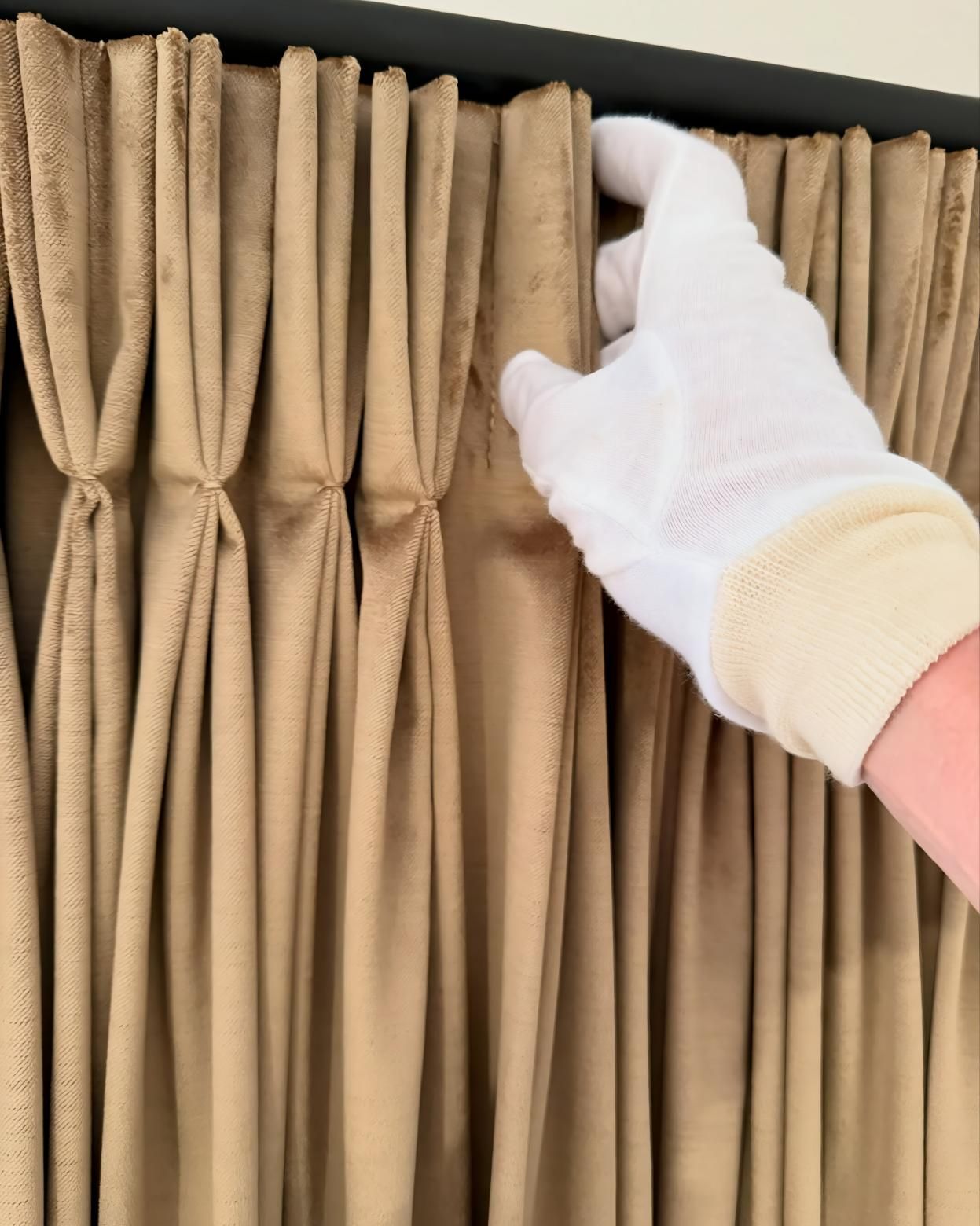 White Glove Hand Touching Pleated Tan Curtain — JSF Interiors Goulburn in Goulburn, NSW