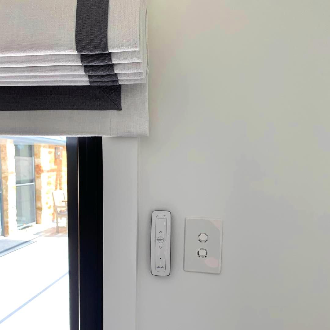 Striped Roman Shade On White Wall — JSF Interiors Goulburn in Dapto, NSW