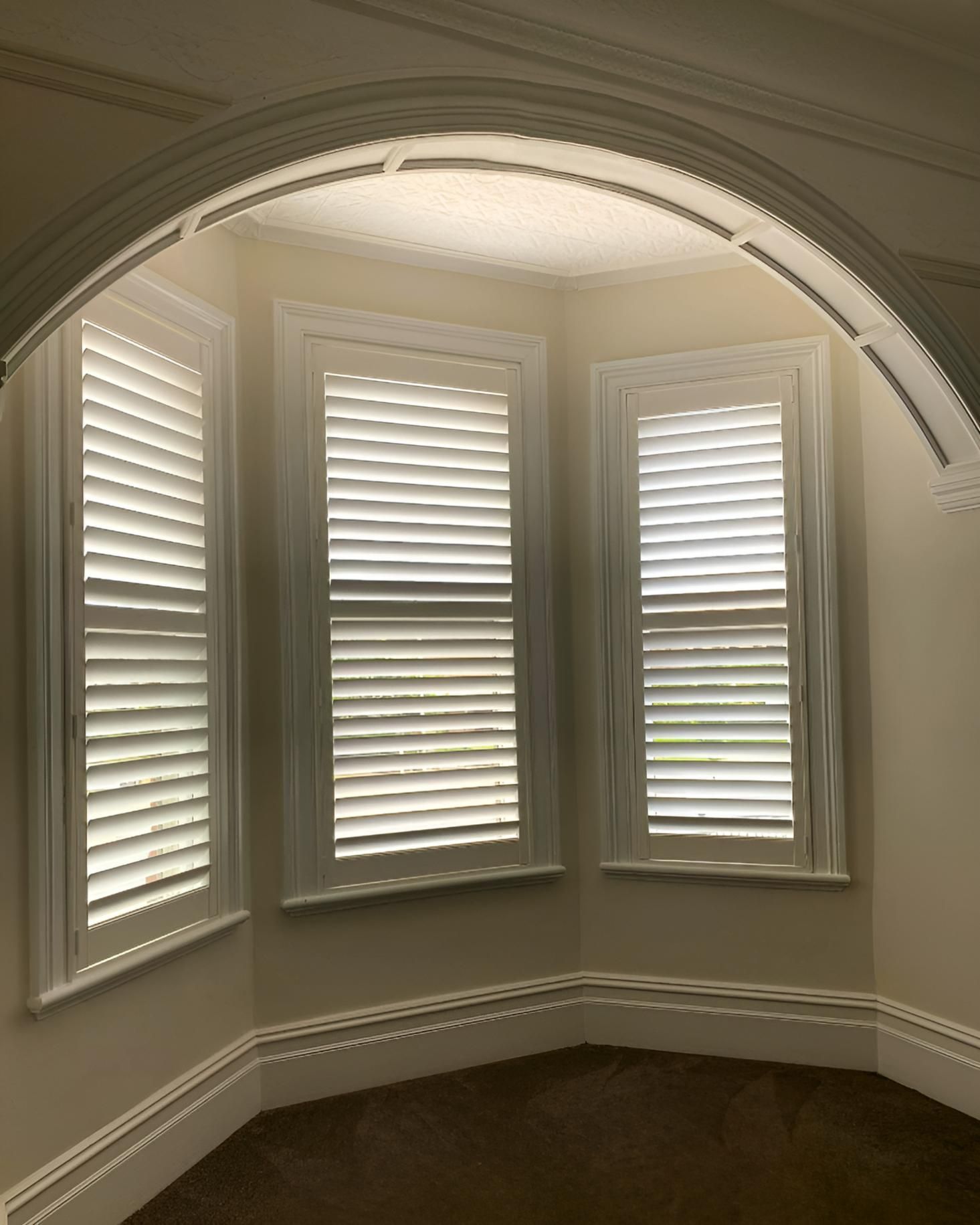 Three White Shuttered Windows In Arched Alcove — JSF Interiors Goulburn in Dapto, NSW