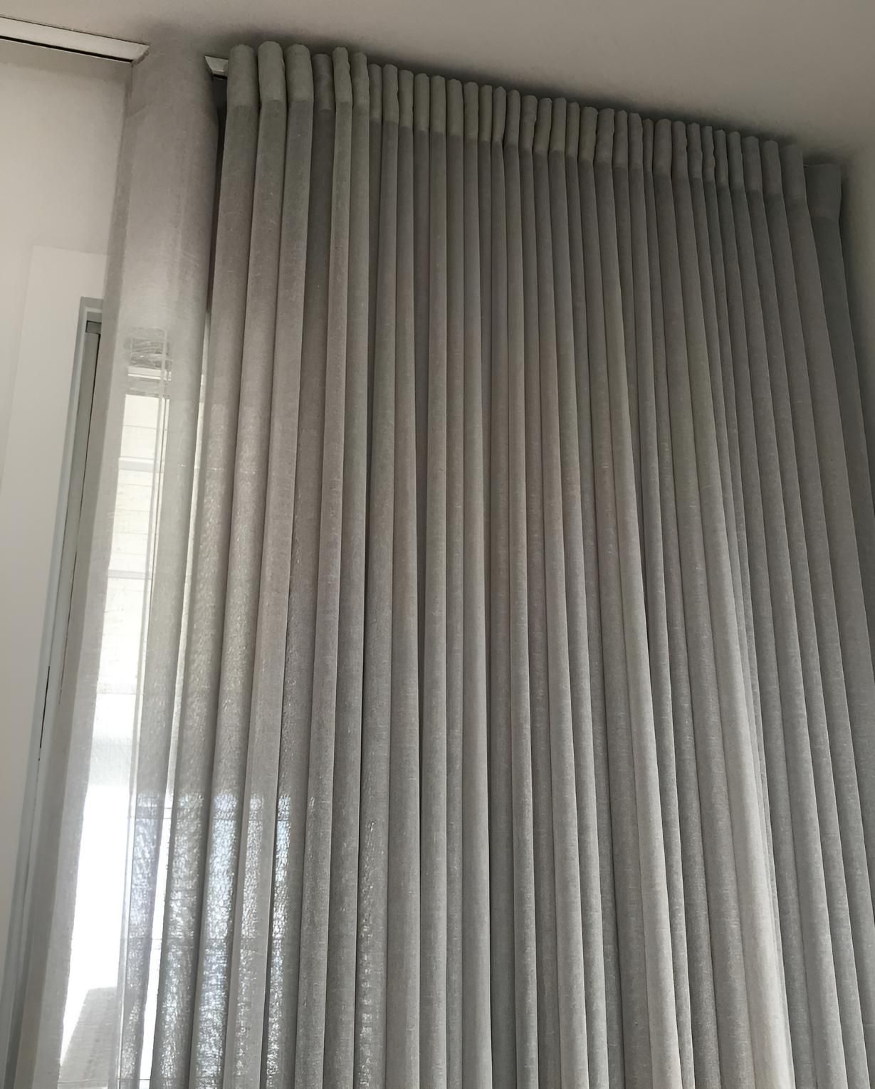Gray Pleated Curtains Hanging In Front Of Window — JSF Interiors Goulburn in Berry, NSW