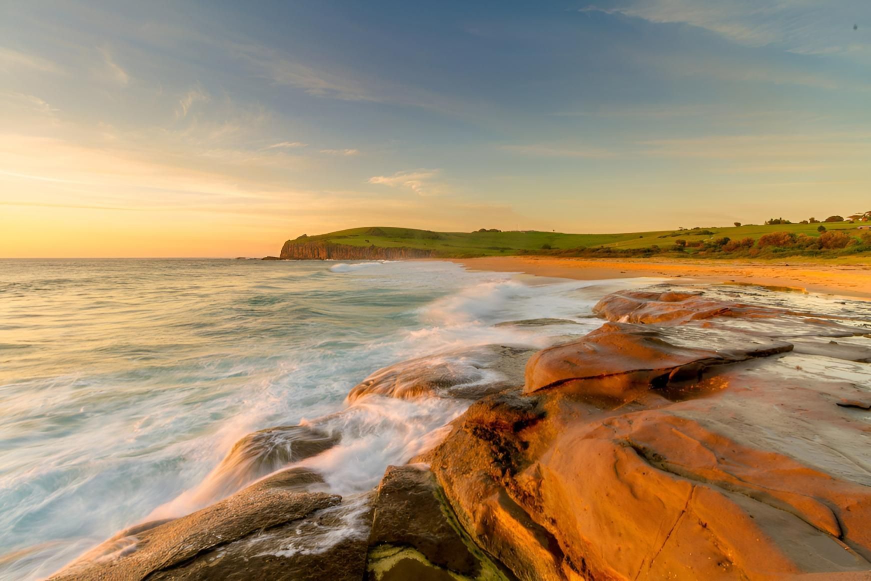 Golden Sunset Over Ocean Waves On Rocky Shore — JSF Interiors Gerringong in Gerringong, NSW