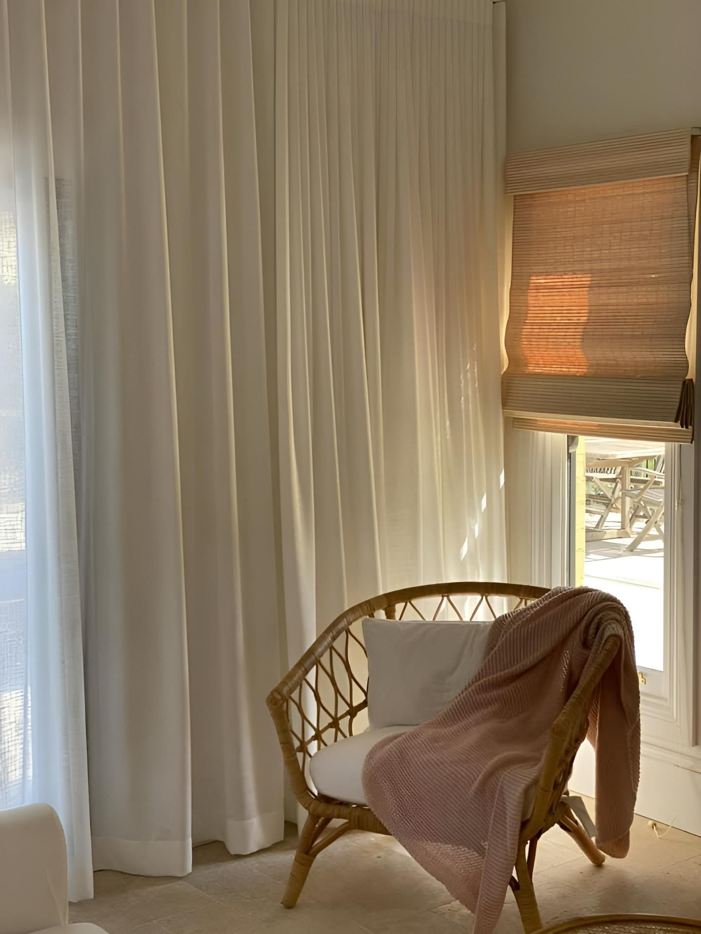 Rattan Chair With Pink Blanket And White Pillow — JSF Interiors Goulburn in Wollongong, NSW