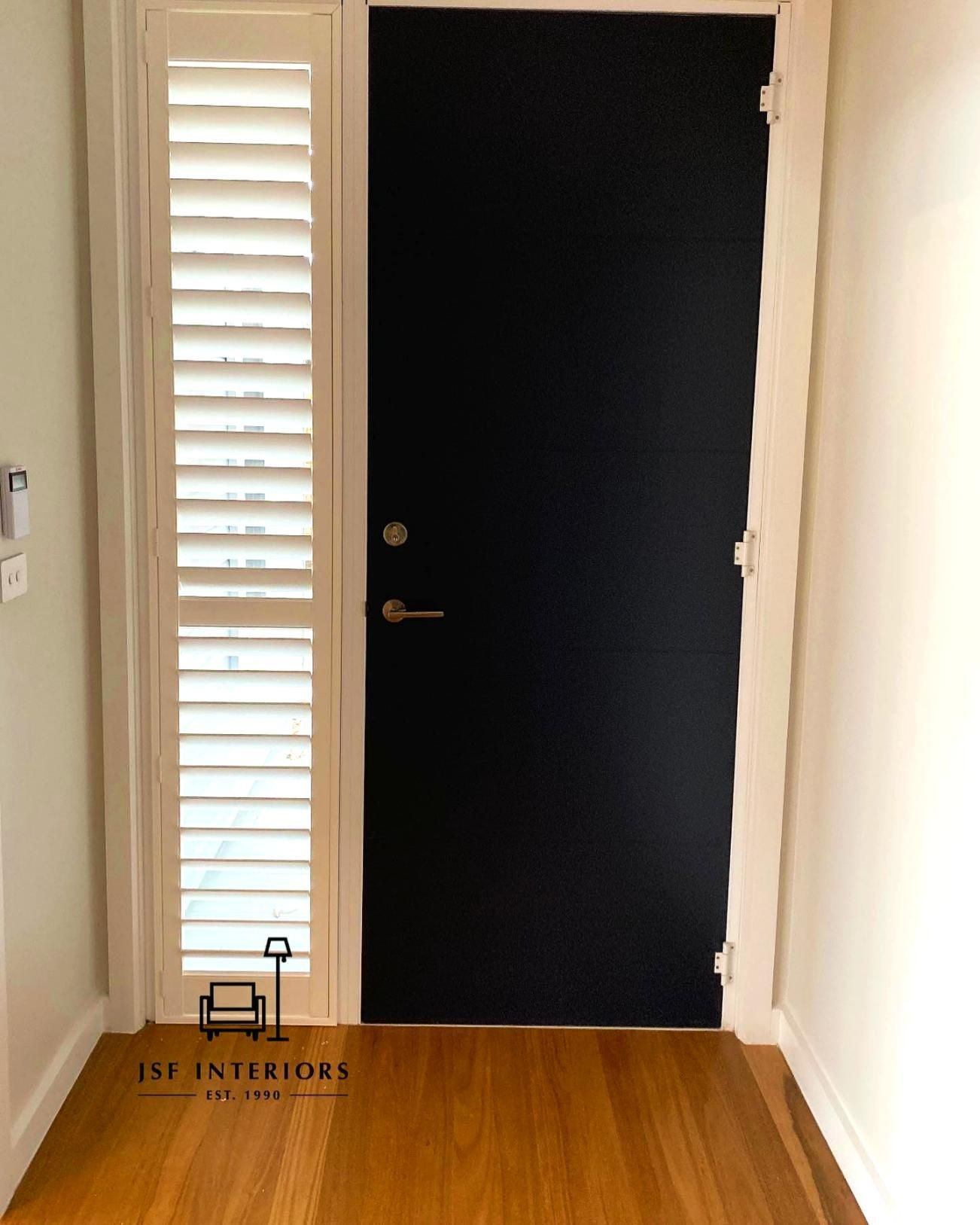 Black Door With Shutter Window And Wooden Floor — JSF Interiors Goulburn in Bowral, NSW