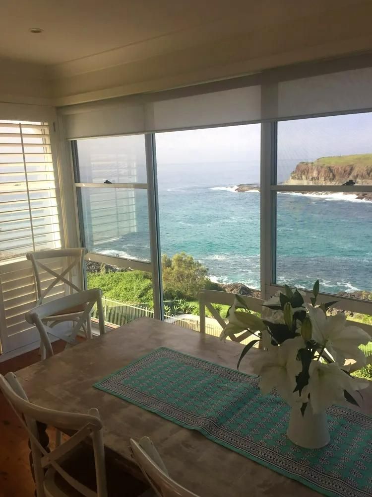 Dining Room With Ocean View And White Furniture — JSF Interiors Goulburn in Goulburn, NSW