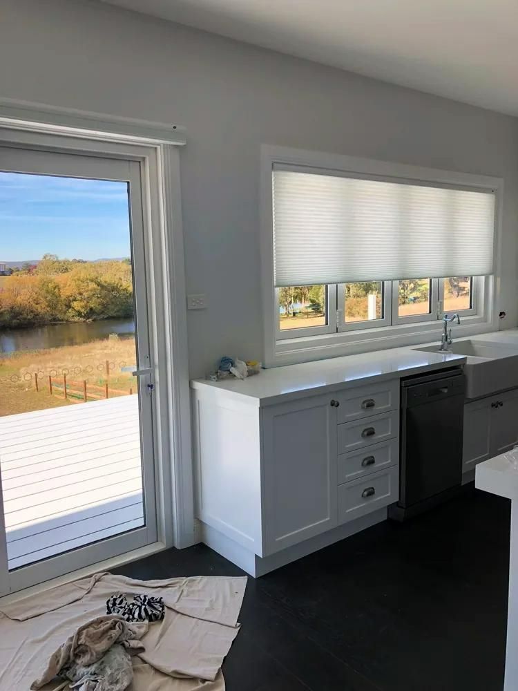 White Kitchen With Cabinetry And Scenic Outdoor View — JSF Interiors Goulburn in Goulburn, NSW