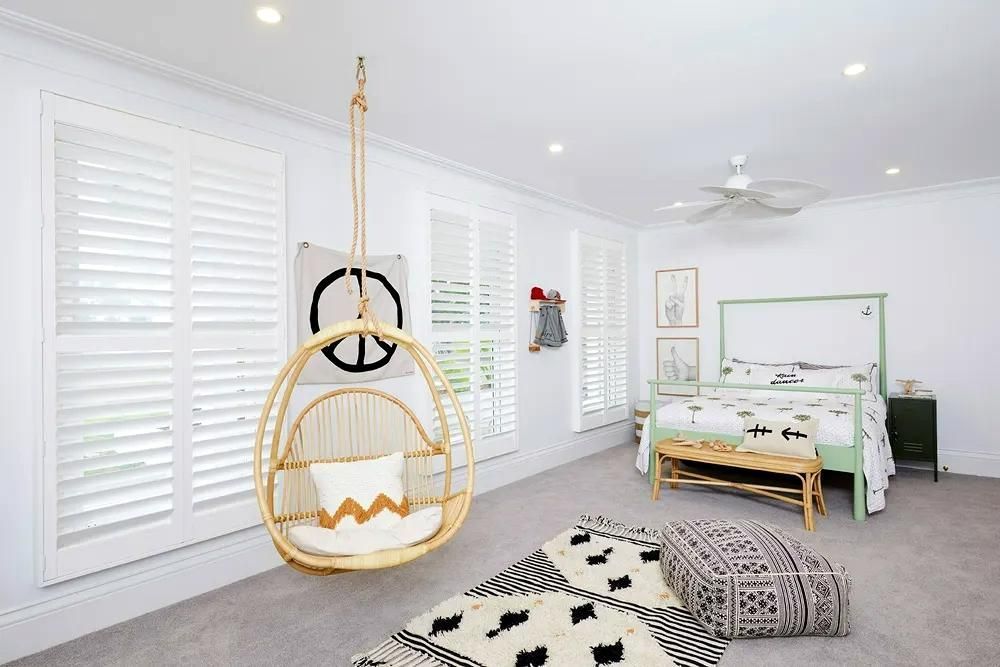 Bedroom With Shutters And Hanging Chair — JSF Interiors Goulburn in Goulburn, NSW