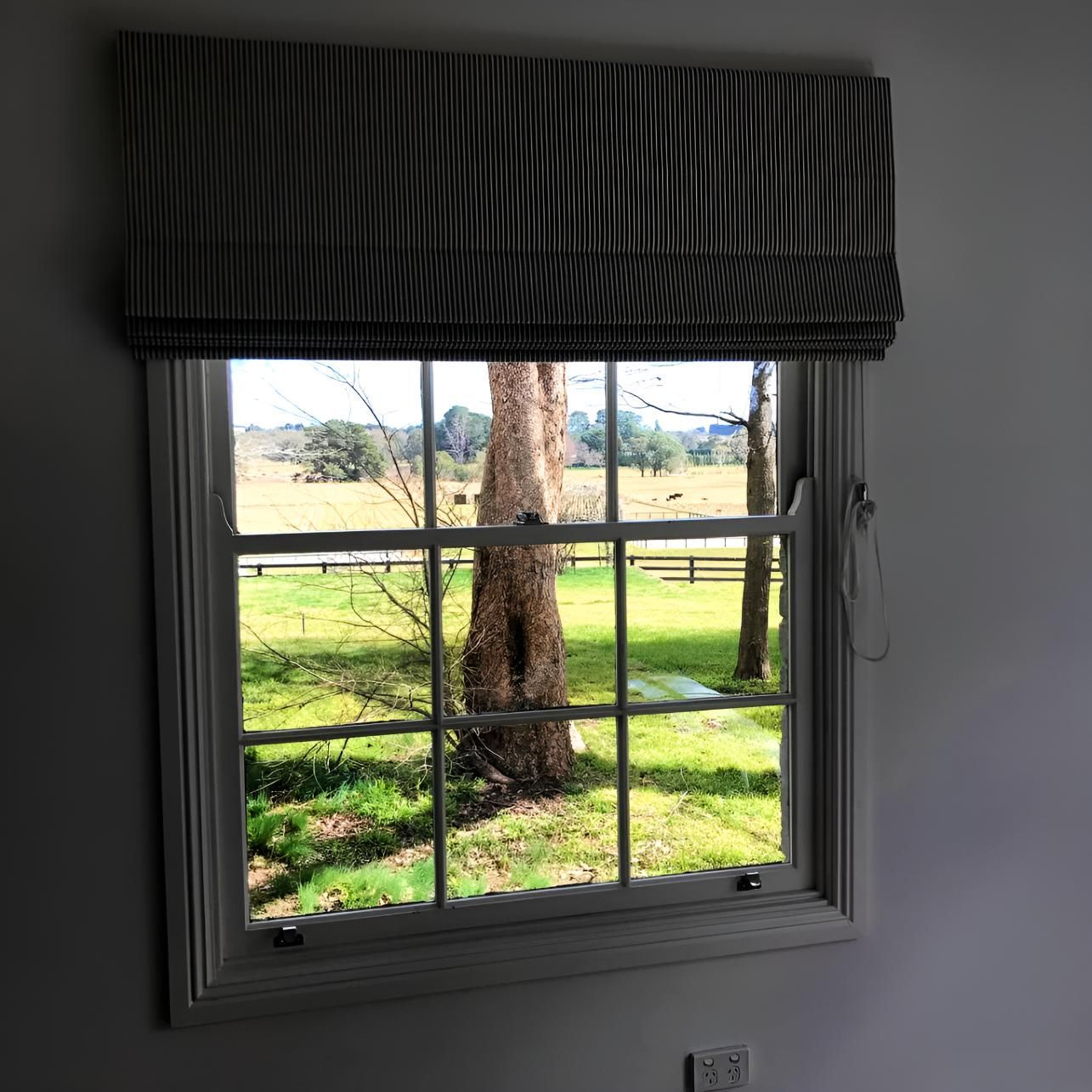Window With Striped Shade And Field View — JSF Interiors Goulburn in Wollongong, NSW