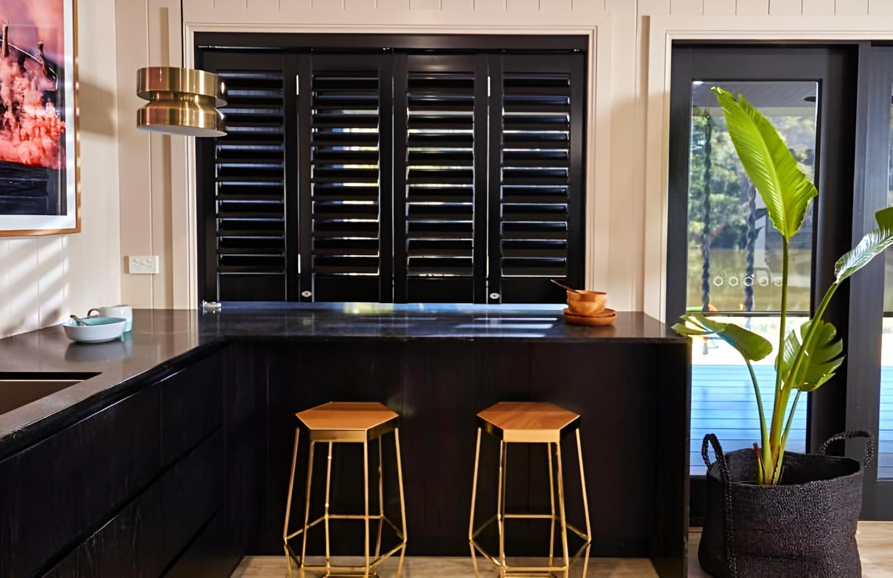 Black Kitchen With Shutters And Gold Stools — JSF Interiors Goulburn in Wollongong, NSW