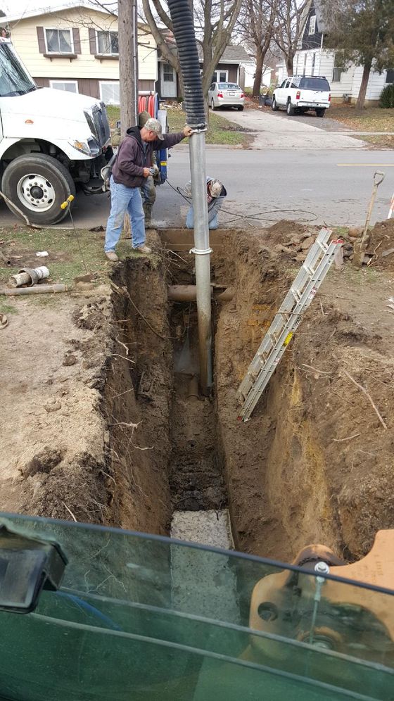 Water Line Service — Workers Fixing the Pipe in Mendota, IL