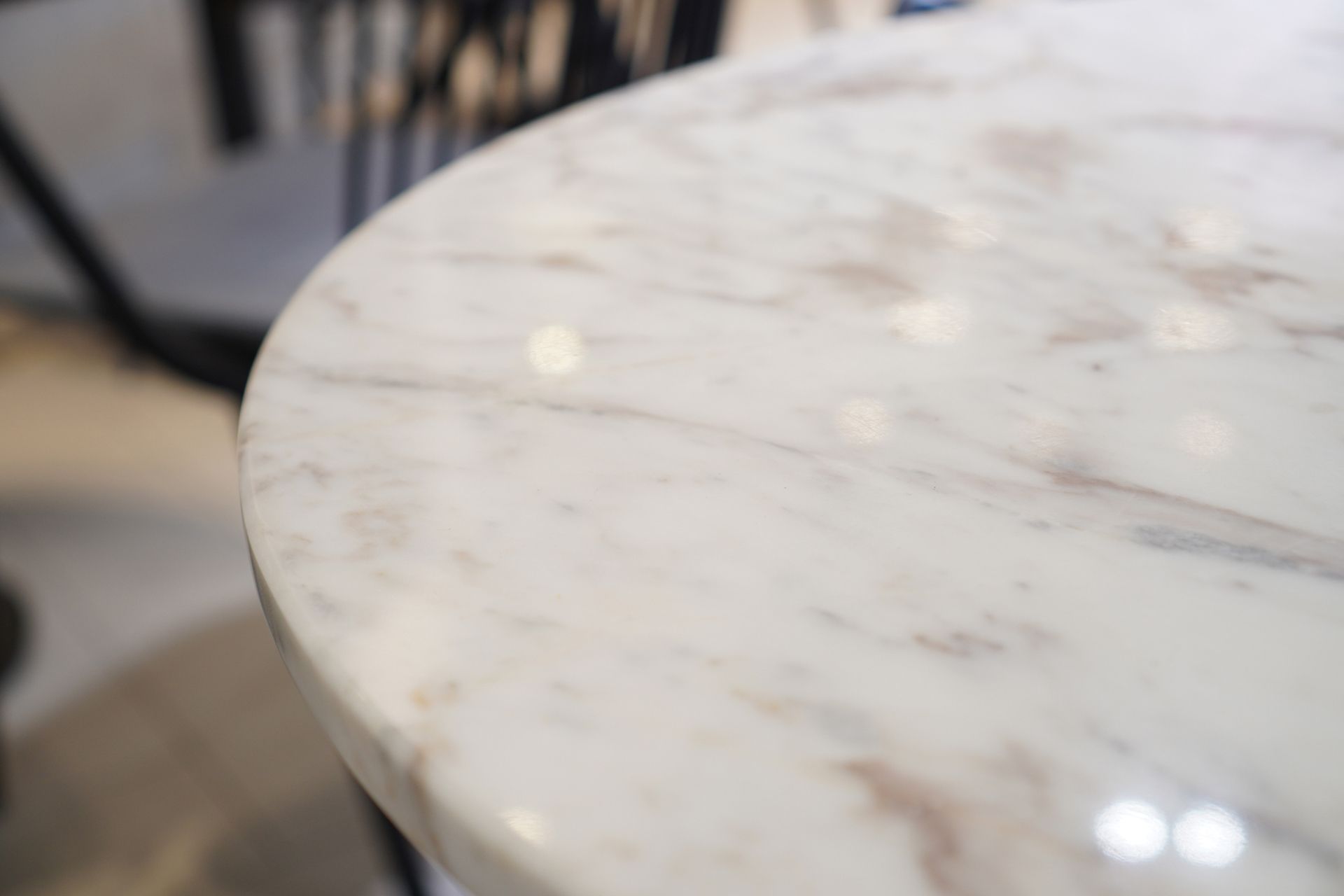 A close up of a marble table top in a room.