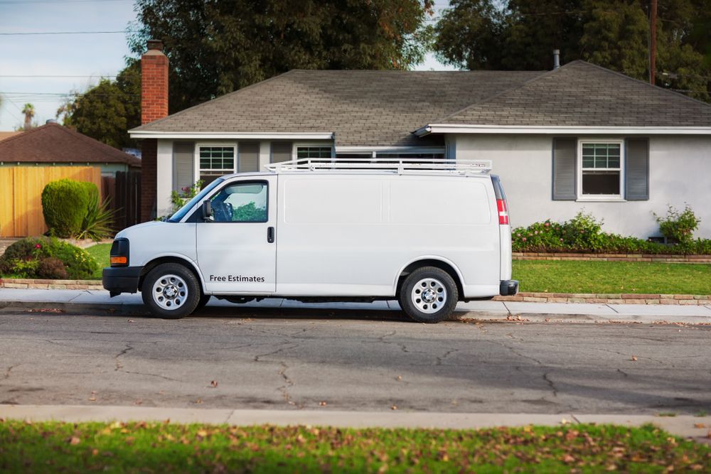White Cargo Van Parked on a Street  — Mid Coast Smash Repairs In Tuncurry, NSW
