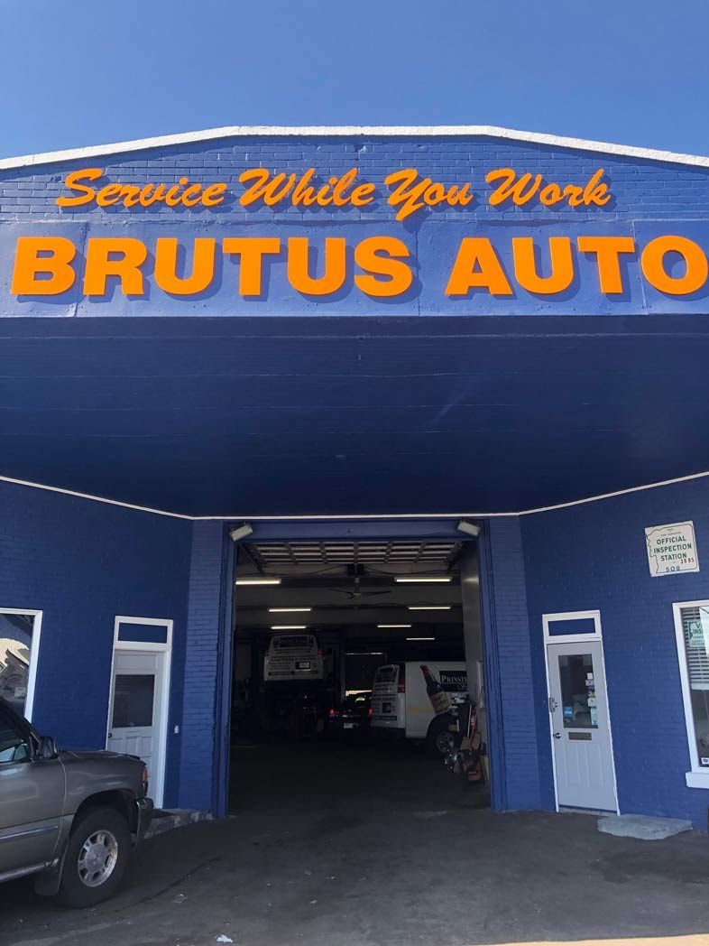 A truck is parked in front of brutus auto