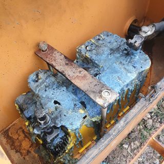 Two blue and yellow boxes are sitting on top of each other in a box.