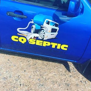 A blue car has a sticker on the side that says cq septic