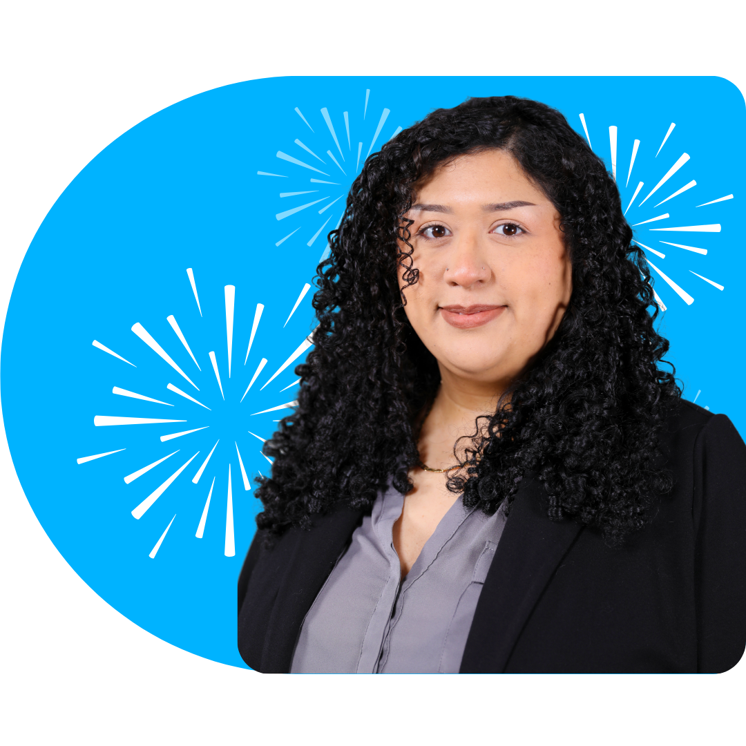 A person smiling, wearing a white blazer against a bright blue background featuring white, stylized firework illustrations.