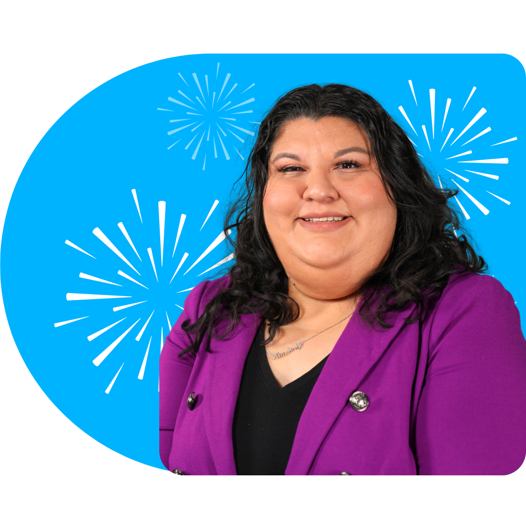 A person smiling, wearing a white blazer against a bright blue background featuring white, stylized firework illustrations.