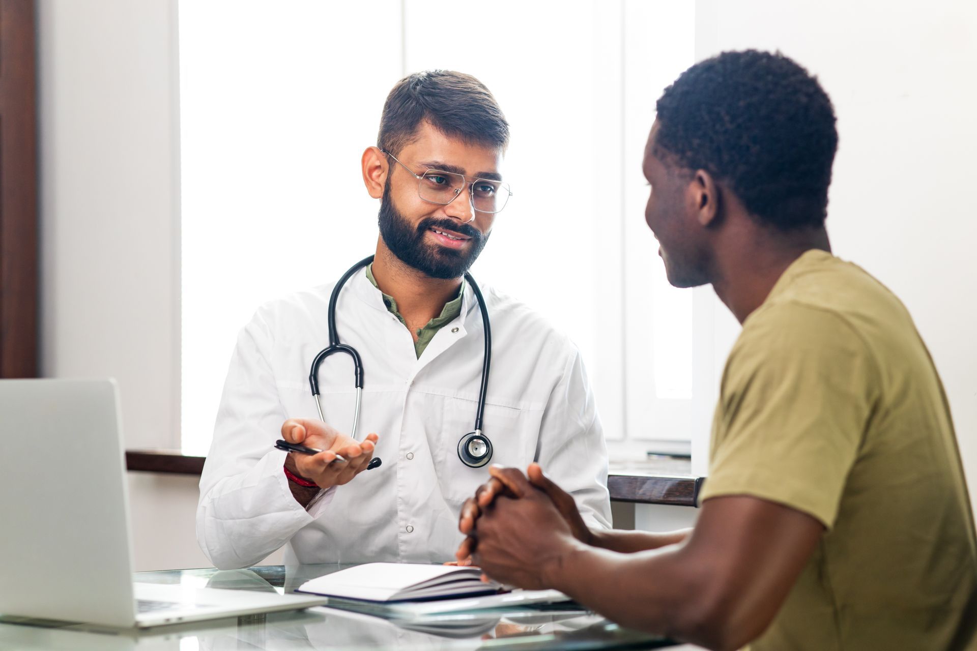 Houston Primary Care Doctor talking to male patient