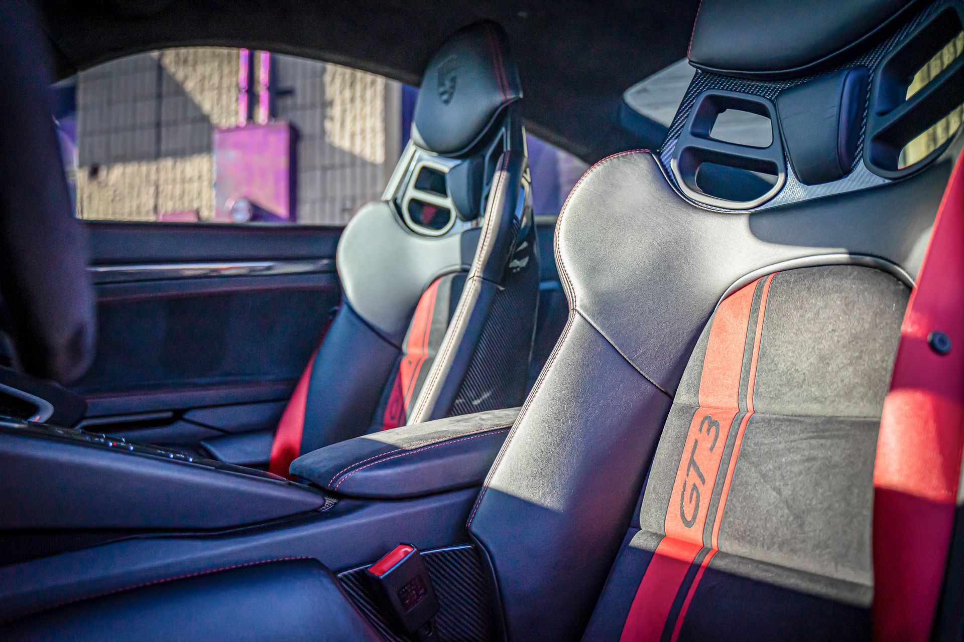 A close up of the seats in a porsche 911 gt3