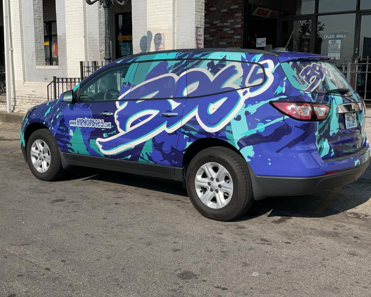 Blue and turquoise SUV with