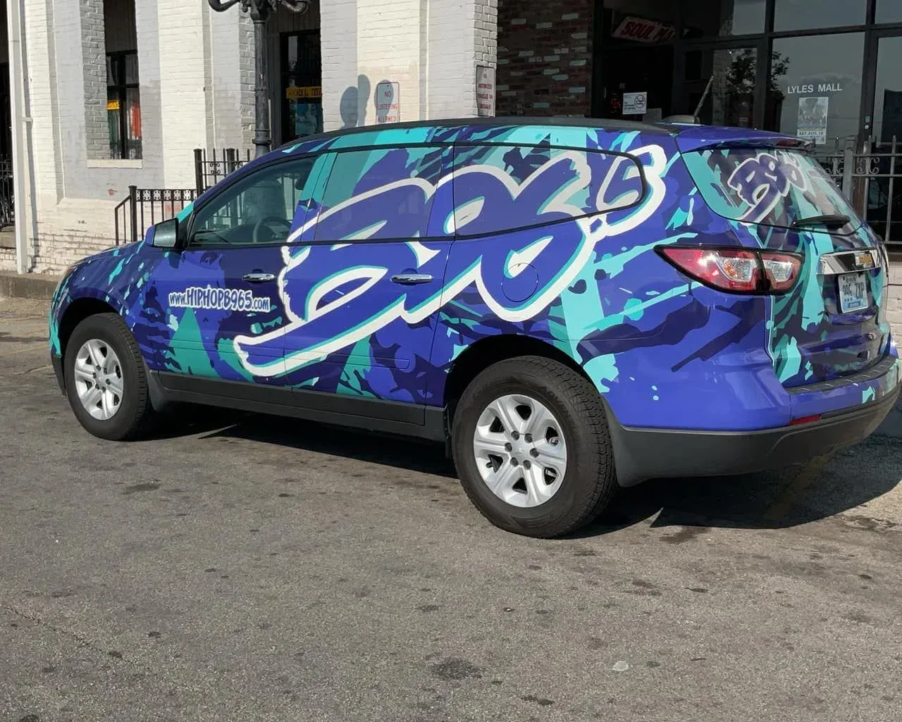 Blue and turquoise SUV with 