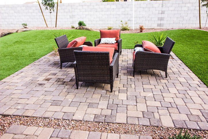 Outdoor Pavers Patio with Four Wicker Chairs