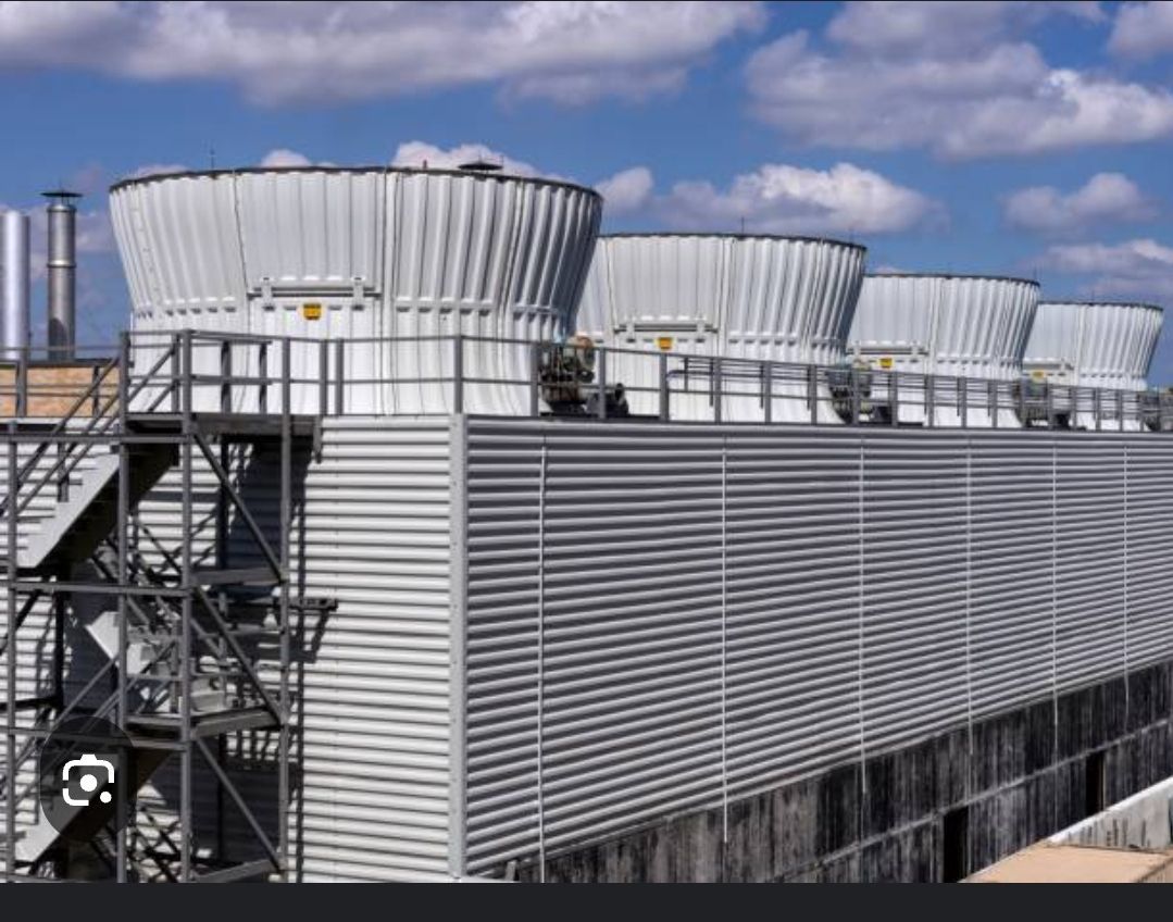 A building with a lot of cooling towers on top of it