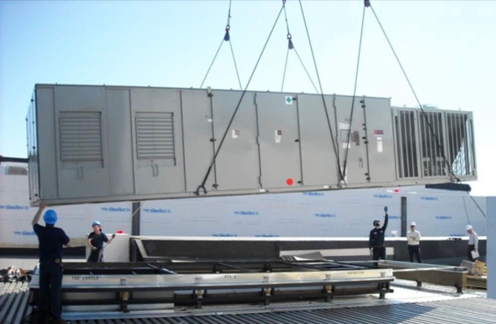 An HVAC technician carefully cleaning and maintaining an air conditioning unit to ensure optimal performance and efficiency.
