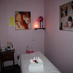 Massage room with portrait — facials in Cedar Park, TX