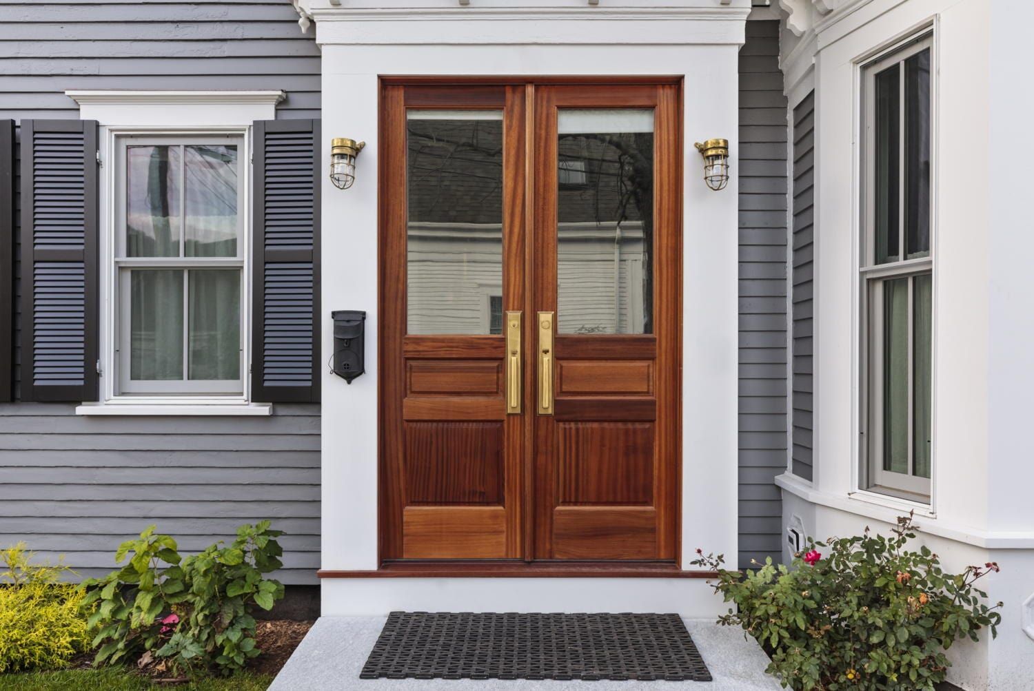 The Front Door of A House with Two Wooden Doors and Two Windows — Lock & Door in Wodonga, VIC