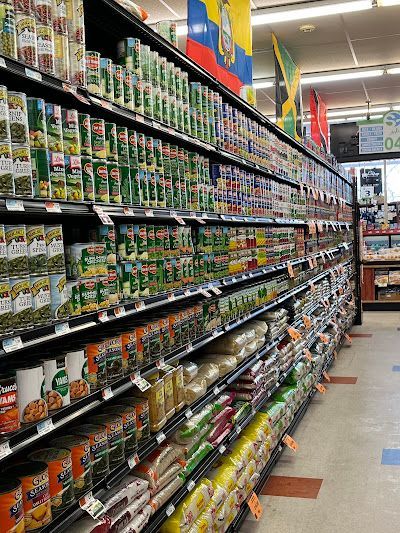 A grocery store aisle filled with lots of canned food.