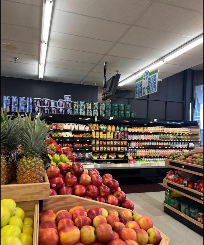 The inside of a grocery store filled with fruits and vegetables