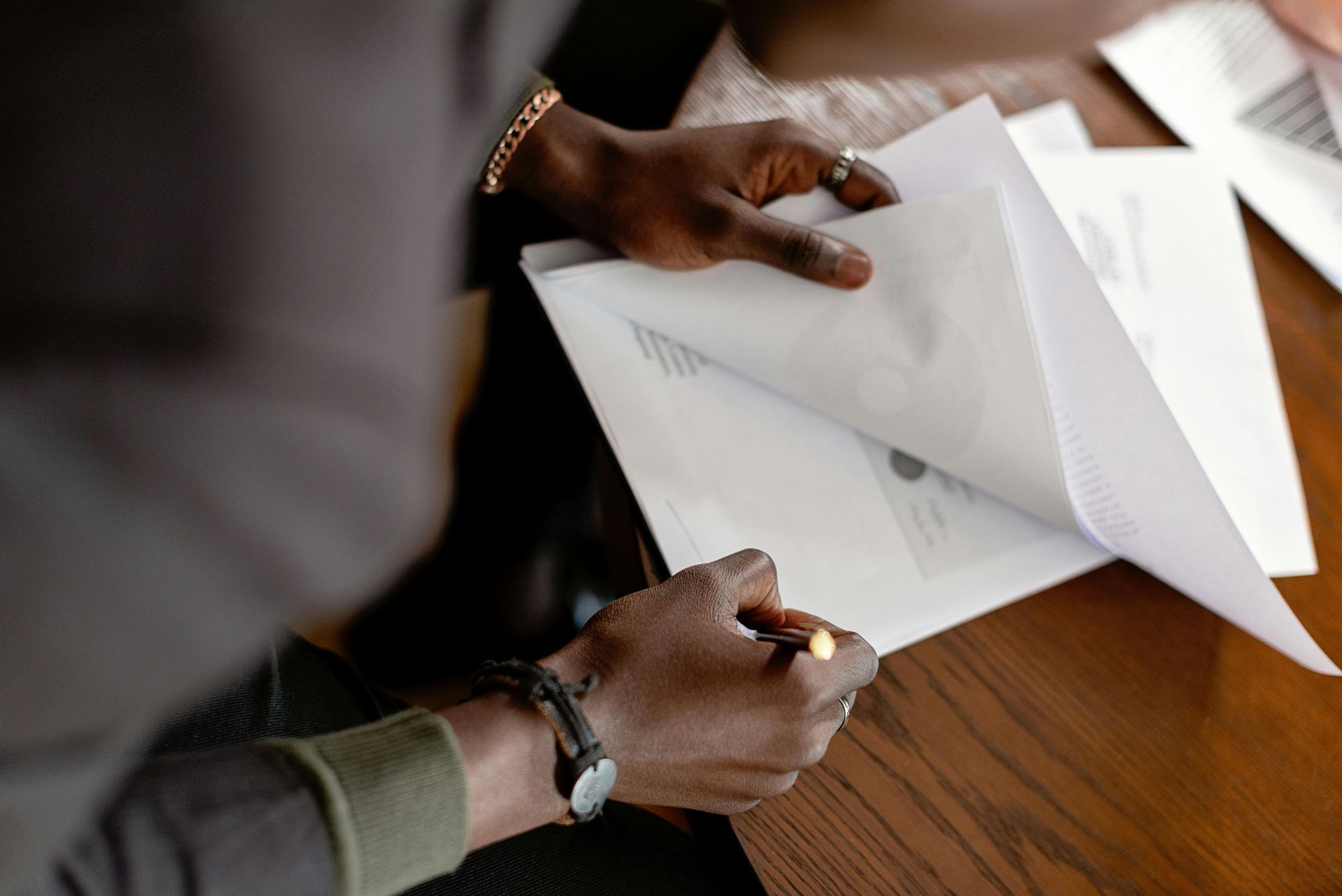 Black Individual Signing Paperwork - Business and Notary Solutions, LLC - Spring, TX
