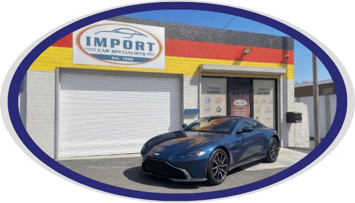 Aston Martin sports car outside Import Car Specialists shop