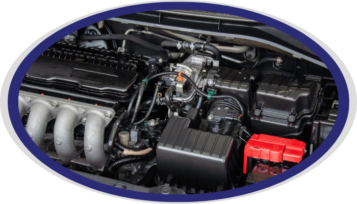 Car engine bay with electrical components and battery