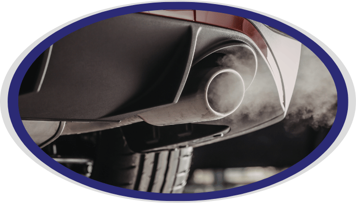 Vehicle exhaust pipe emitting emissions