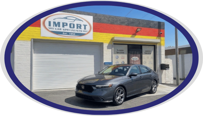 Honda sedan in front of Import Car Specialists shop