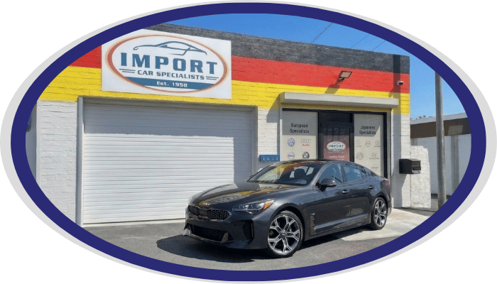 Kia sedan parked at Import Car Specialists shop