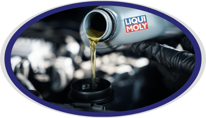 Motor oil being poured during oil change service