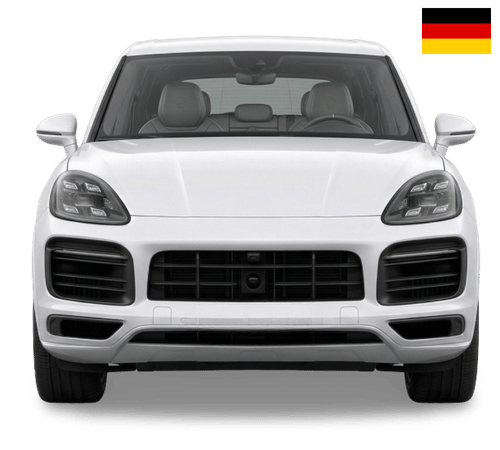 White Porsche Cayenne SUV seen from the front, with a small German flag icon in the upper right corner.