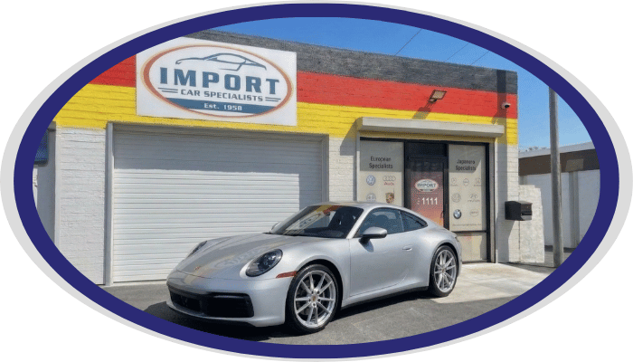 Porsche sports car parked outside Import Car Specialists shop